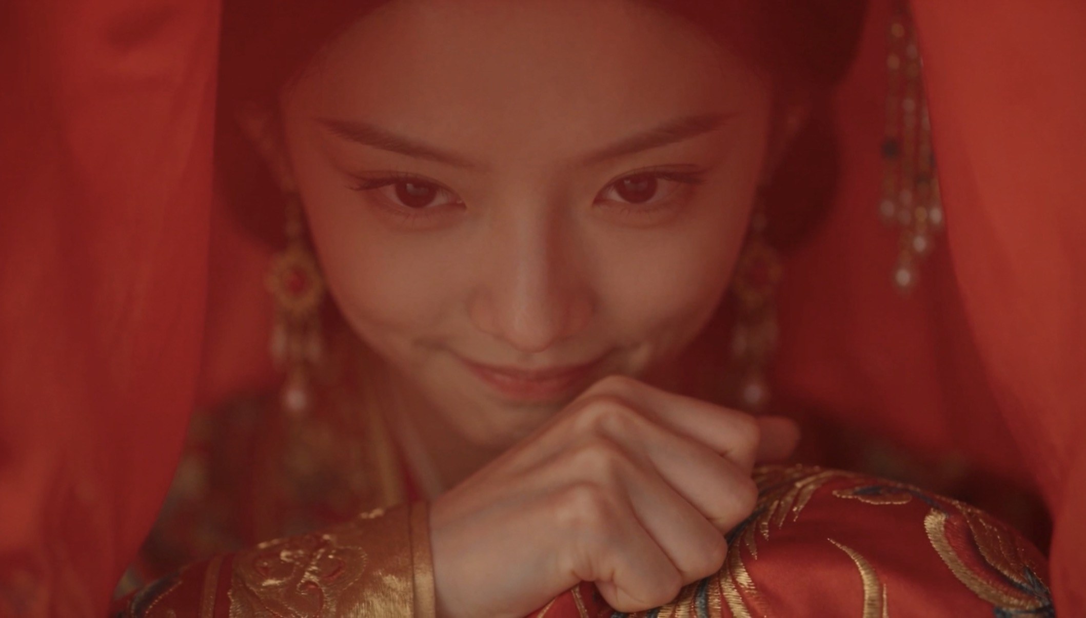 Bride behind a red veil